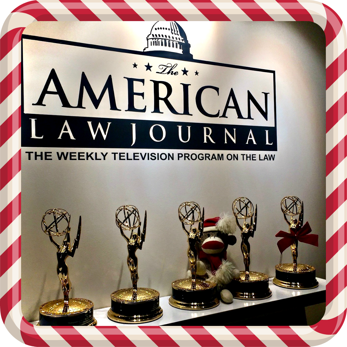 Emmys with Christmas Monkey with candy cane frame.png